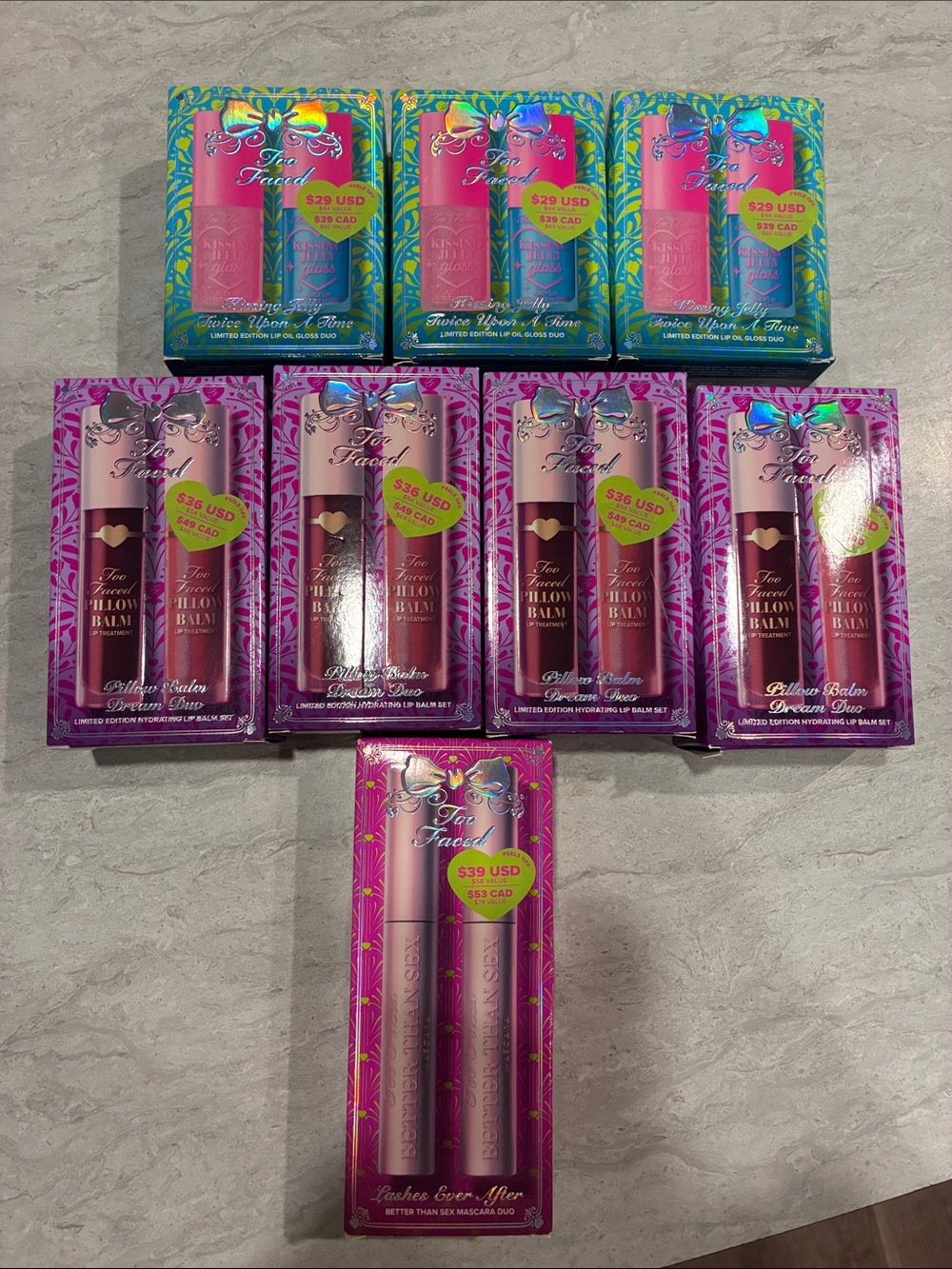 Too Faced Lip Duo Sets in Pink and Teal Packaging